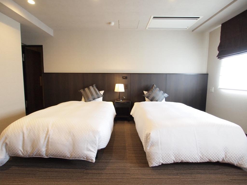 Sunsky Hotel Kitakyushu Bagian luar foto